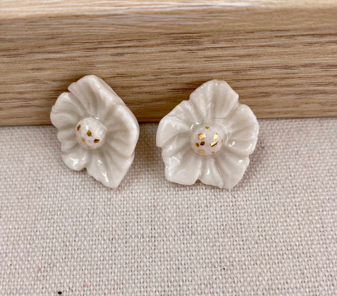 Dogwood flower shaped porcelain earring. 24k gold accents.